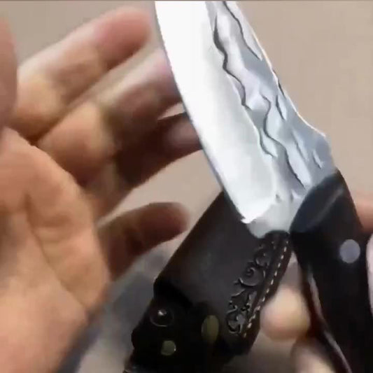 DefendGear Emberfang fixed-blade knife showing flame-like blade detailing